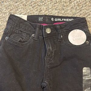 Gap size 6 girls black denim lined with pink fleece. Never worn tags on